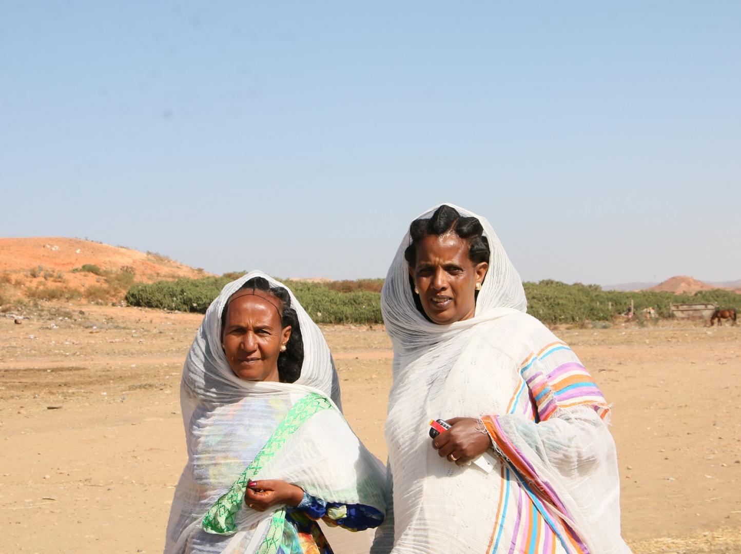 Genet Mahari (left) and Tieba Abraha are trained community health volunteers who go house to house in their community and can screen and detect malnutrition among children under five. 